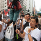 Protestors hold up a toy wolf depicting Hong Kong chief executive Leung Chun-yin at a rally in July 2014.